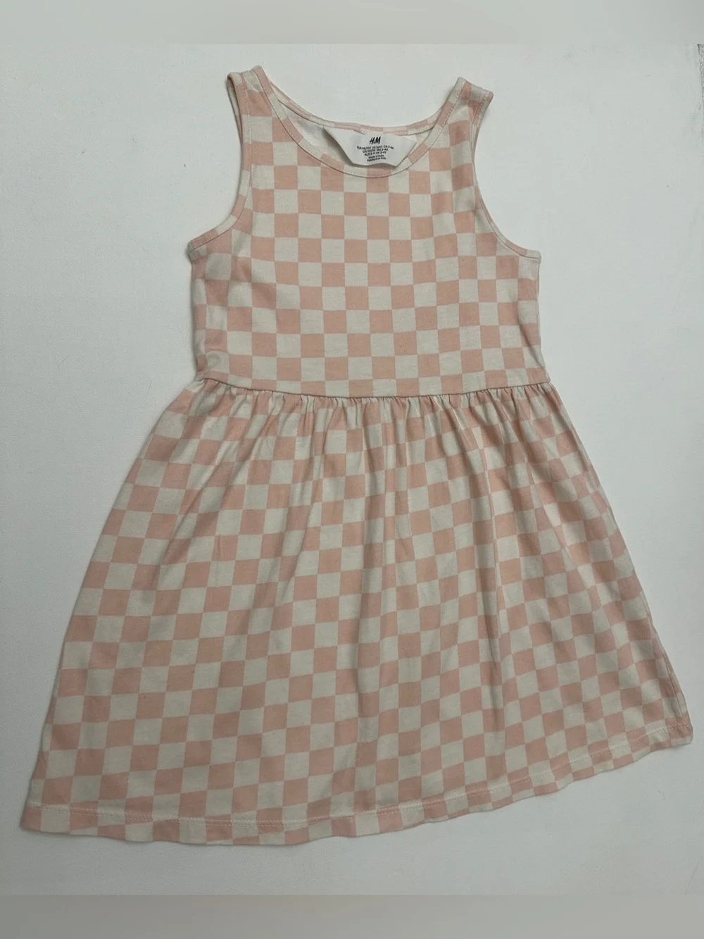 H&M girl’s patterned jersey dress checkered design a flared skirt.  Size 3-4T.